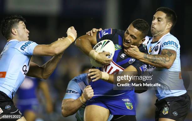 Marcelo Montoya of the Bulldogs is tackled by Gerard Beale and Chad Townsend of the Sharks during the round 12 NRL match between the Cronulla Sharks...