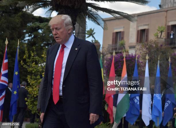 President Donald Trump arrive for a family photo with leaders of the G7 and leaders of some African countries that have been invited for the two-day...