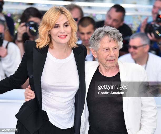French actress Emmanuelle Seigner and Polish-French director Roman Polanski pose during a photocall for the film D' apres une histoire vraie out of...