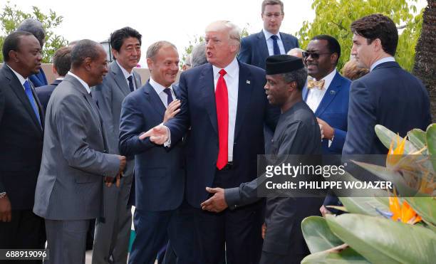 European Council President Donald Tusk , US President Donald Trump , Japanese Prime Minister Shinzo Abe and Canadian Prime Minister Justin Trudeau...