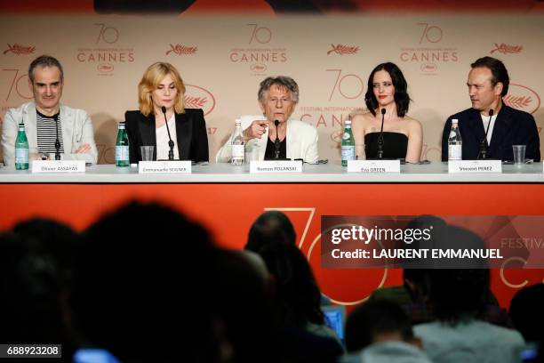 French-Polish director Roman Polanski talks on May 27, 2017 during a press conference with French director and screenwriter Olivier Assayas , French...