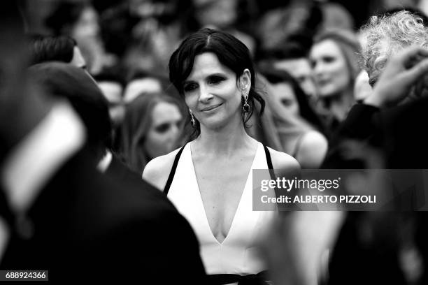 French actress Juliette Binoche arrives on May 26, 2017 for the screening of the film 'L'Amant Double' at the 70th edition of the Cannes Film...