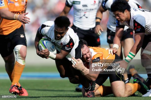 Kotaro Matsushima of the Sunwolves is tackled by Charles Marais of the Cheetahs during the Super Rugby Rd 14 match between Sunwolves and Cheetahs at...