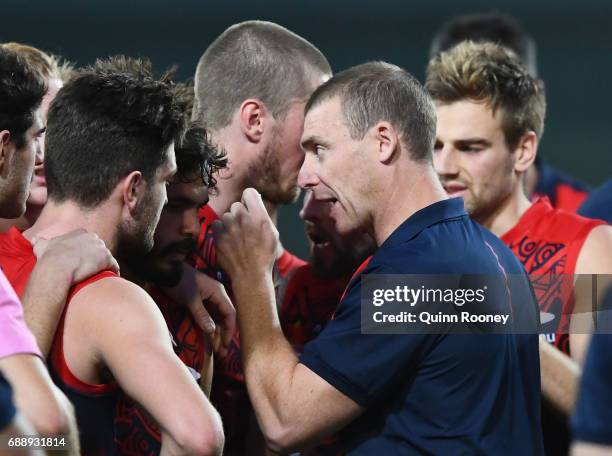 Demons head coach Simon Goodwin speaks to his players during the round ten AFL match between the Melbourne Demons and the Gold Coast Suns at Traeger...