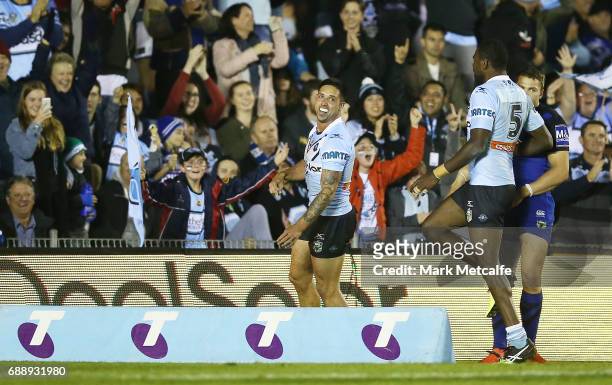 Gerard Beale of the Sharks celebrates scoring a try during the round 12 NRL match between the Cronulla Sharks and the Canterbury Bulldogs at Southern...