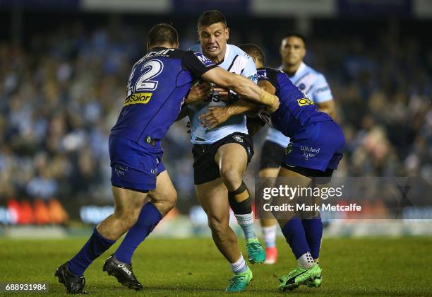 Chris Heighington of the Sharks is tackled during the round 12 NRL match between the Cronulla Sharks and the Canterbury Bulldogs at Southern Cross...