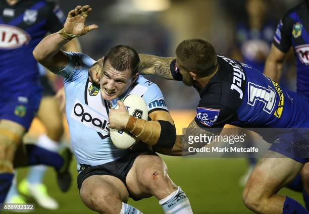 Paul Gallen of the Sharks is tackled during the round 12 NRL match between the Cronulla Sharks and the Canterbury Bulldogs at Southern Cross Group...