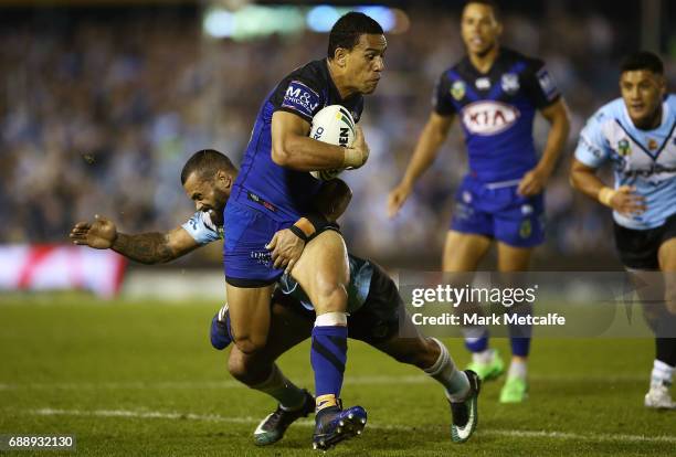 Will Hopoate of the Bulldogs is tackled during the round 12 NRL match between the Cronulla Sharks and the Canterbury Bulldogs at Southern Cross Group...