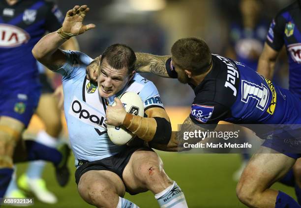 Paul Gallen of the Sharks is tackled during the round 12 NRL match between the Cronulla Sharks and the Canterbury Bulldogs at Southern Cross Group...