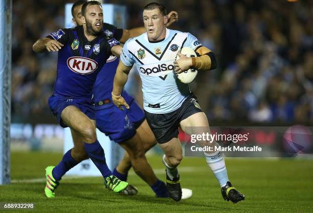 Paul Gallen of the Sharks runs behind his own line leading to a Sharks try during the round 12 NRL match between the Cronulla Sharks and the...