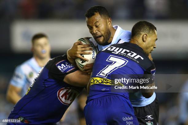 Jayson Bukuya of the Sharks is tackled during the round 12 NRL match between the Cronulla Sharks and the Canterbury Bulldogs at Southern Cross Group...