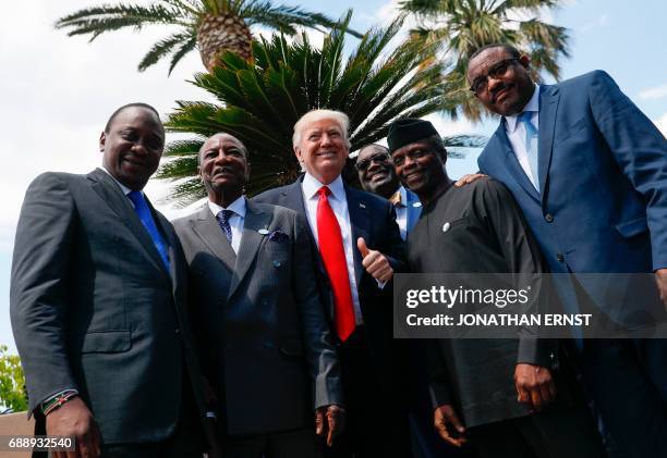 Kenya's President Uhuru Kenyatta, Guinea's President Alpha Conde, US President Donald Trump, African Development Bank President Akinwumi Adesina,...