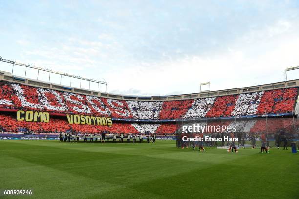 Players walk into the pitch prior to the UEFA Champions League Semi Final second leg match between Club Atletico de Madrid and Real Madrid CF at...
