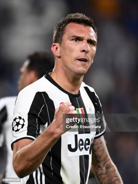 Mario Mandzukic of Juventus celebrates scoring the opening goal during the UEFA Champions League Semi Final second leg match between Juventus and AS...