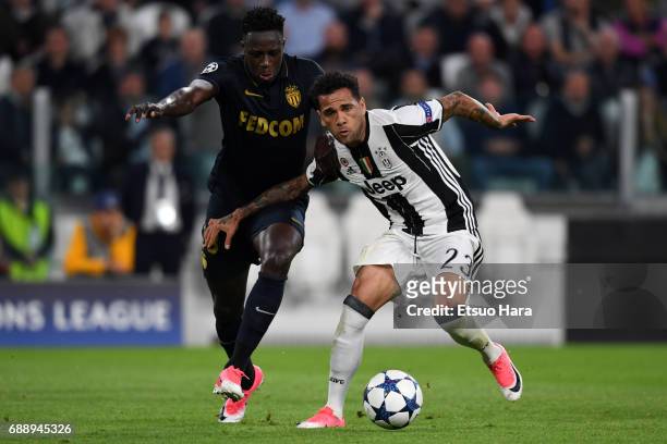 Dani Alves of Juventus and Benjamin Mendy of AS Monaco compete for the ball during the UEFA Champions League Semi Final second leg match between...