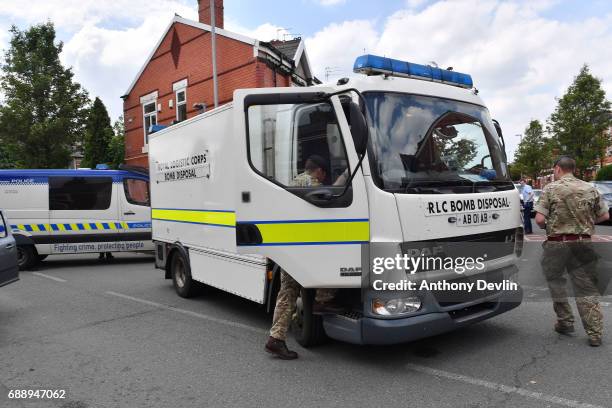 Bomb disposal team attends the scene of a raid in the Moss Side area as part of the ongoing police investigation following the terror attack earlier...
