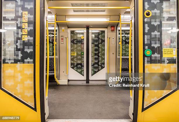 open doors of subway train - berlin stock-fotos und bilder