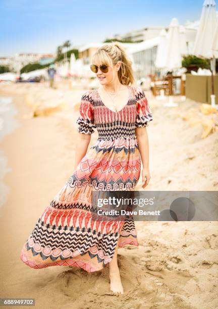 Camilla Kerslake wearing Moy Atelier sunglases poses at Nikki Beach during the 70th Annual Cannes Film Festival on May 26, 2017 in Cannes, France.