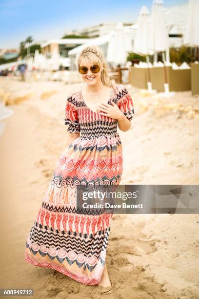 Camilla Kerslake wearing Moy Atelier sunglases poses at Nikki Beach during the 70th Annual Cannes Film Festival on May 26, 2017 in Cannes, France.