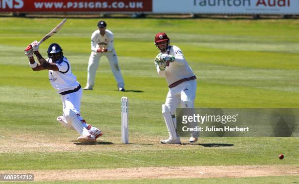 Michael Carberry of Hampshire hits out past Steve Davies of Somerset during Day Two of The Specsavers County Championship Division One match between...