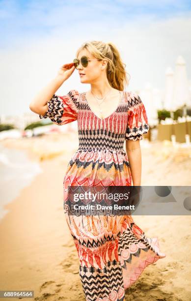 Camilla Kerslake wearing Moy Atelier sunglases poses at Nikki Beach during the 70th Annual Cannes Film Festival on May 26, 2017 in Cannes, France.