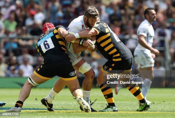 Geoff Parling of Exeter Chiefs is tackled by James Haskell and Phil Swainston of Wasps during the Aviva Premiership Final between Wasps and Exeter...