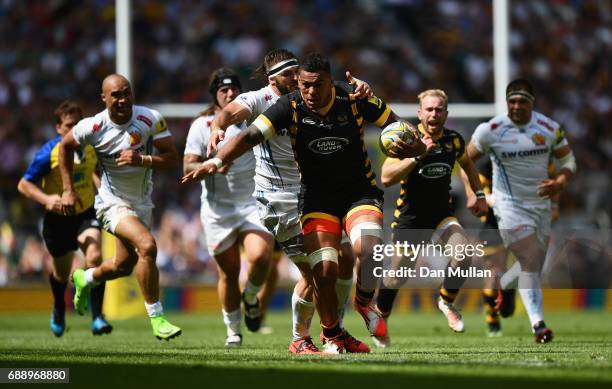 Nathan Hughes of Wasps is tackled by Don Armand of Exeter Chiefs during the Aviva Premiership Final between Wasps and Exeter Chiefs at Twickenham...