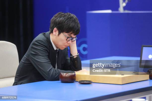 China's 19-year-old Go player Ke Jie prepares to make a move during the final match against Google's artificial intelligence programme AlphaGo in...