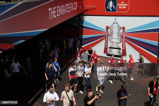 Football fans make their way to Wembley Stadium ahead of the FA Cup final on May 27, 2017 in London, England. Football fans will watch Arsenal play...