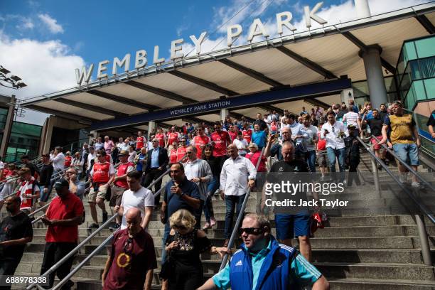 Football fans make their way to Wembley Stadium from Wembley Park Tube Station ahead of the FA Cup final on May 27, 2017 in London, England. Football...