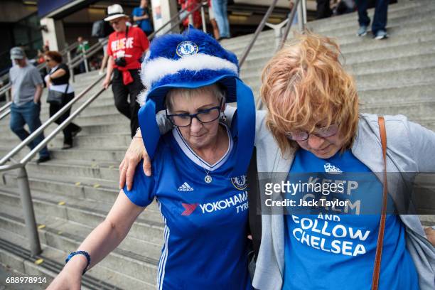 Football fans arrive at Wembley Park Tube Station ahead of the FA Cup final on May 27, 2017 in London, England. Football fans will watch Arsenal play...
