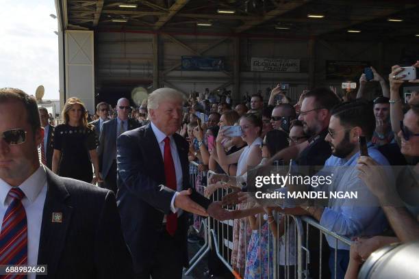 President Donald Trump and US First Lady Melania Trump greet US military personnel and families at Naval Air Station Sigonella after G7 summit of...