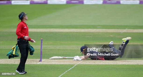 Eoin Morgan of England dives to make his ground during the 2nd Royal London One day International match between England and South Africa at The Ageas...