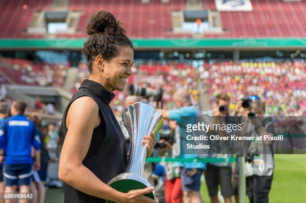 The DFB Cup is brought into the stadium by Celia Sasic during the Women's DFB Cup Final 2017 between SC Sand and VfL Wolfsburg at RheinEnergieStadion...