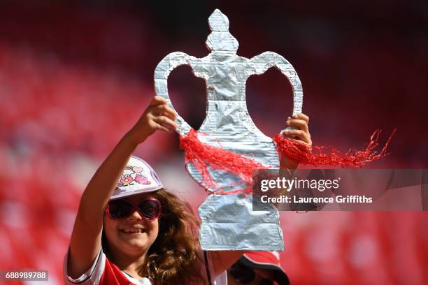 An Arsenal fan holds up a homemade FA Cup Trophy prior to The Emirates FA Cup Final between Arsenal and Chelsea at Wembley Stadium on May 27, 2017 in...