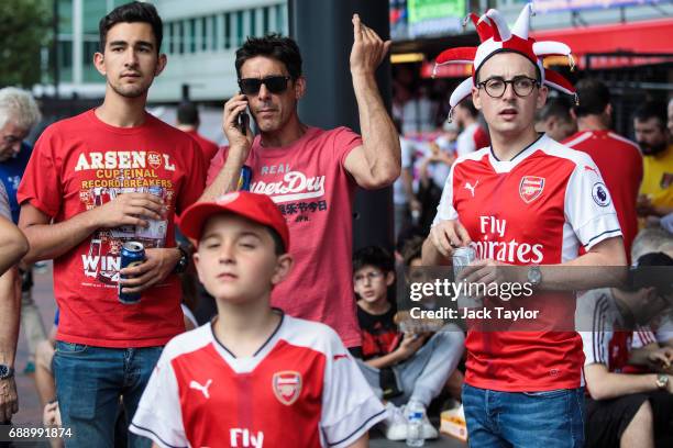 Football fans gather outside Wembley Stadium ahead of the FA Cup final on May 27, 2017 in London, England. Football fans will watch Arsenal play...