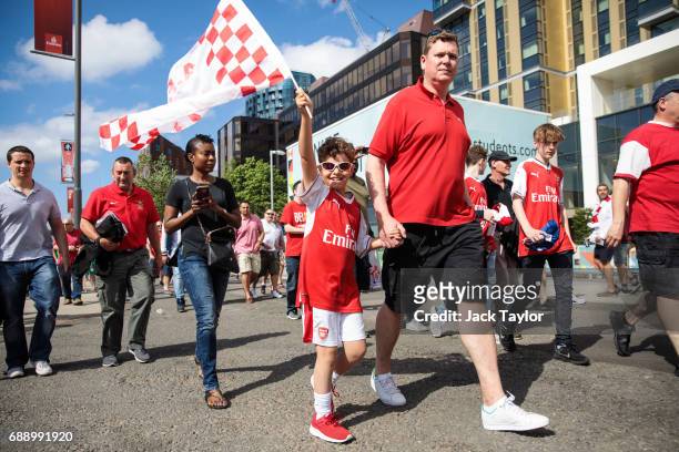 Football fans make their way to Wembley Stadium ahead of the FA Cup final on May 27, 2017 in London, England. Football fans will watch Arsenal play...