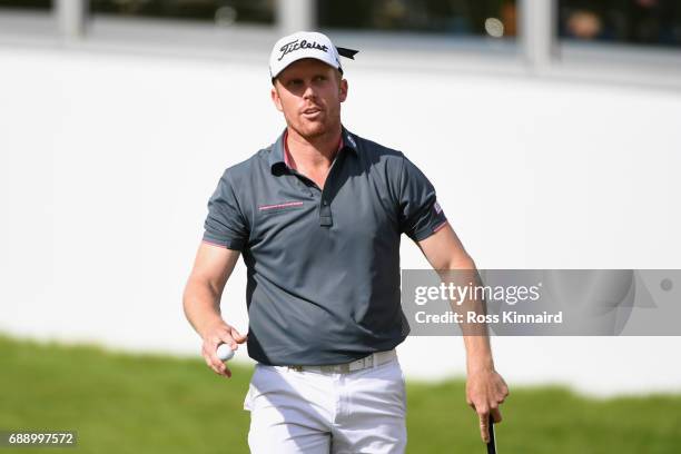 Andrew Dodt of Australia acknowledges the crowd on the 18th green during day three of the BMW PGA Championship at Wentworth on May 27, 2017 in...