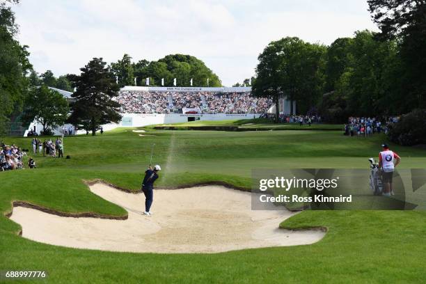 Jaco Van Zyl of South Africa hits from a bunker on the 18th hole during day three of the BMW PGA Championship at Wentworth on May 27, 2017 in...