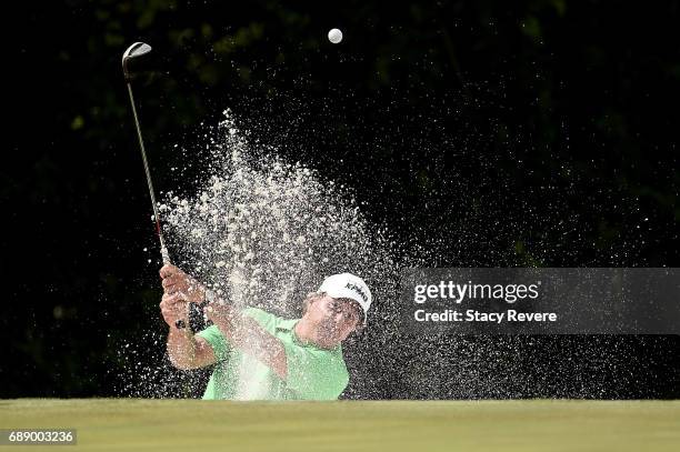 Phil Mickelson plays a shot from a bunker on the 11th hole during Round Two of the DEAN & DELUCA Invitational at Colonial Country Club on May 27,...