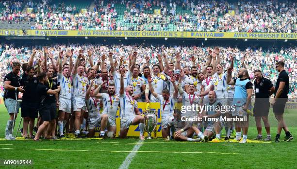 The Exeter Chiefs players celebrates with The Aviva Premiership trophy after the Aviva Premiership Final between Wasps and Exeter Chiefs at...