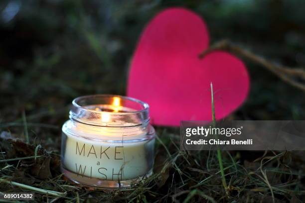 candle and heart - controluce stock pictures, royalty-free photos & images