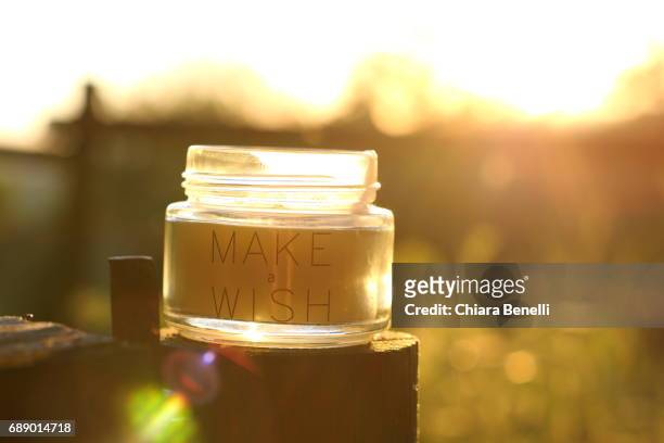 candle at sunset - controluce stock pictures, royalty-free photos & images