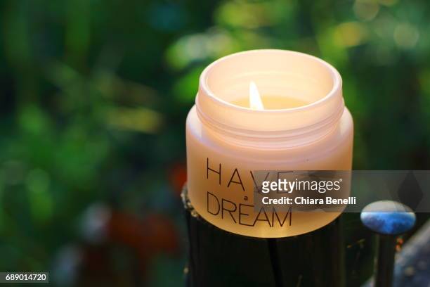 candle at sunset - controluce stock pictures, royalty-free photos & images