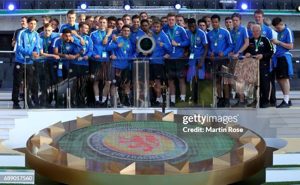 The team of Braunschweig celebrates winning the DFB Juniors Cup Final 2017 between Eintracht Braunschweig U19 and FC Carl Zeiss Jena U19 prior to the...