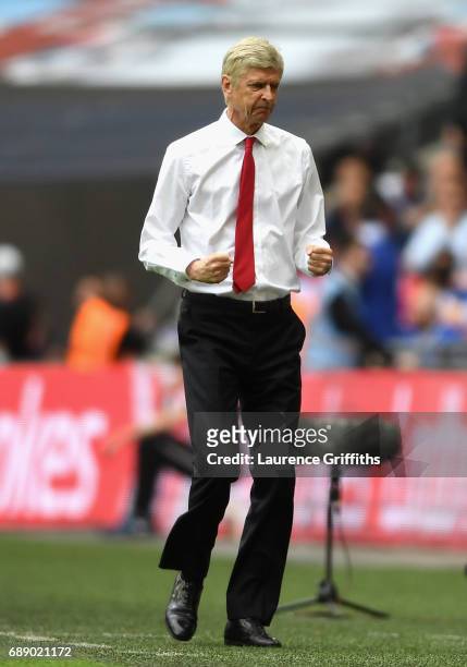 Arsene Wenger, Manager of Arsenal celebrates his teams first goal during The Emirates FA Cup Final between Arsenal and Chelsea at Wembley Stadium on...