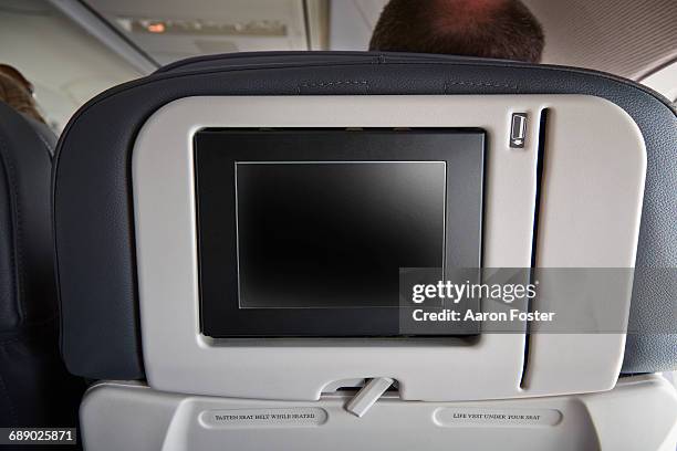 airline video screen on back of seat - aircraft planes aaron foster stock pictures, royalty-free photos & images