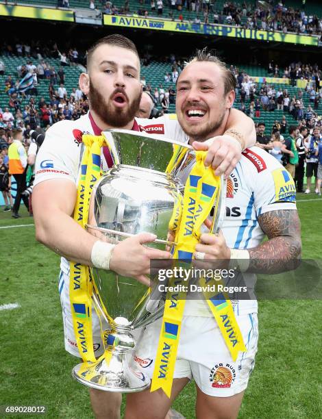 Jack Nowell of Exeter Chiefs celerbates with team mate Luke Cowan-Dickie after their victory during the Aviva Premiership match between Wasps and...