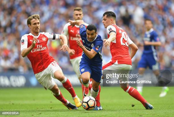 Pedro of Chelsea is closed down by Nacho Monreal and Granit Xhaka of Arsenal during The Emirates FA Cup Final between Arsenal and Chelsea at Wembley...