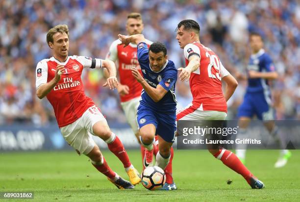 Pedro of Chelsea attempts to get past Nacho Monreal of Arsenal during The Emirates FA Cup Final between Arsenal and Chelsea at Wembley Stadium on May...